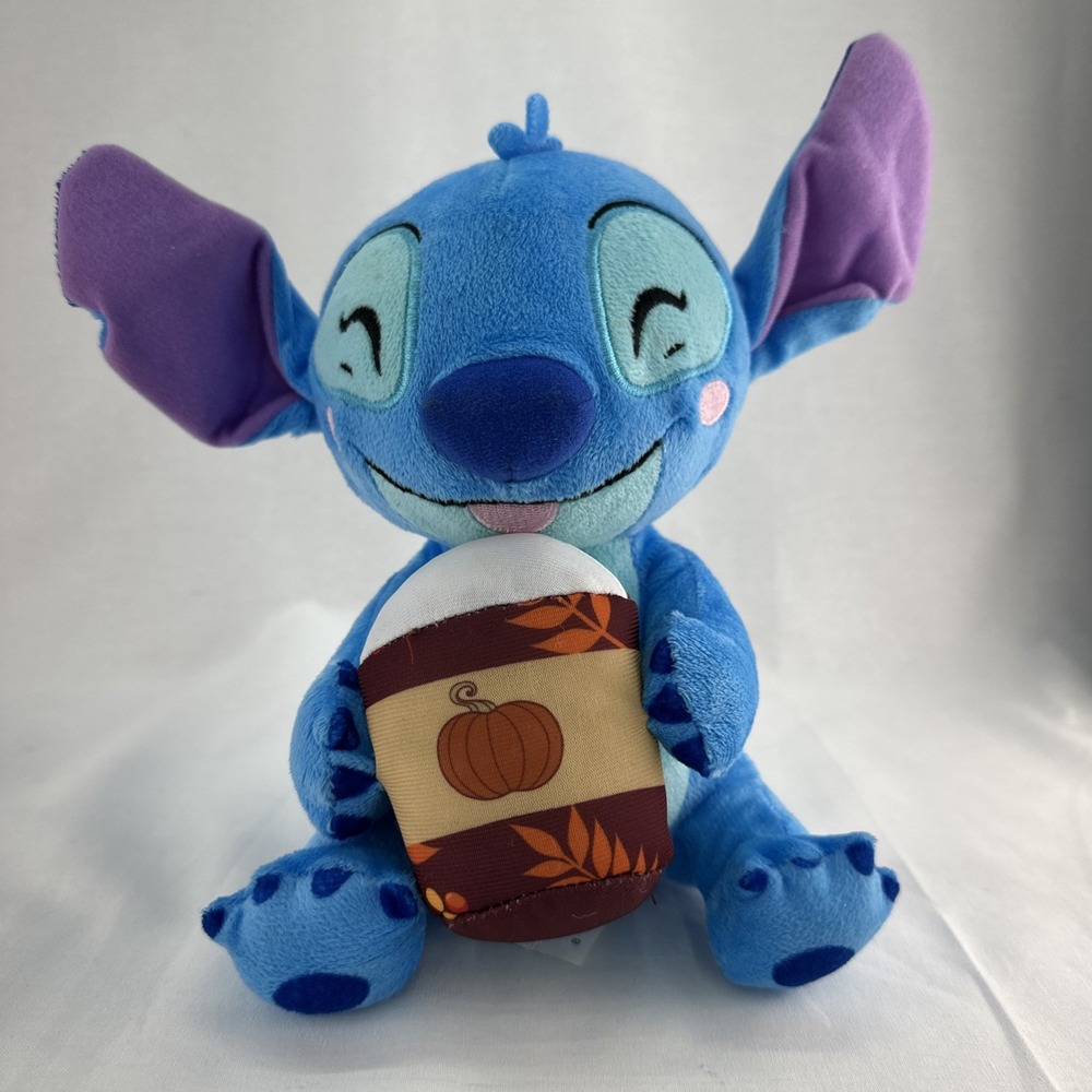 Disney Stitch sitting Holding a Cup Of Pumpkin Spice Coffee 7.5 in plush.